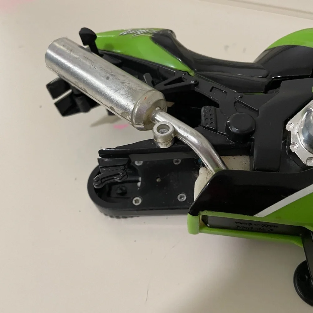 Ninja Green Kids Motorcycle Toy - wheel is missing side is broken